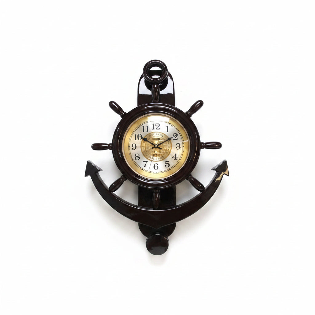 A decorative nautical wall clock shaped like an anchor with a ship's wheel steering wheel design, featuring a gold-toned clock face with black hands and Roman numerals.