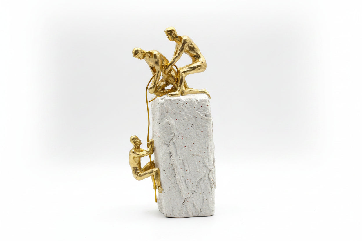 Motivational Gold Mountaineer Climbing Teamwork Statue on White Rock Base